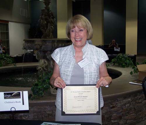 Carol with her award